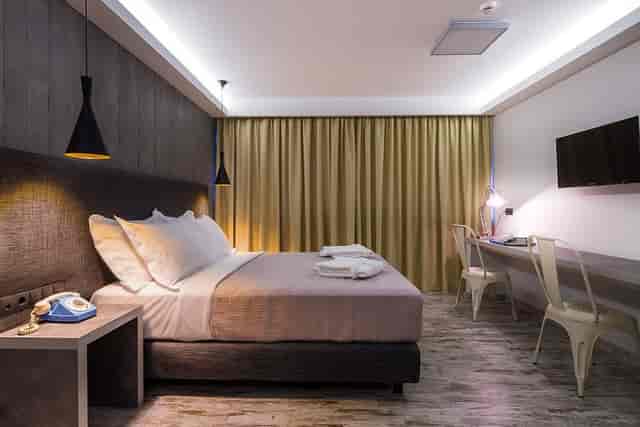Modern hotel suite with workspace for business conferences and corporate travel.