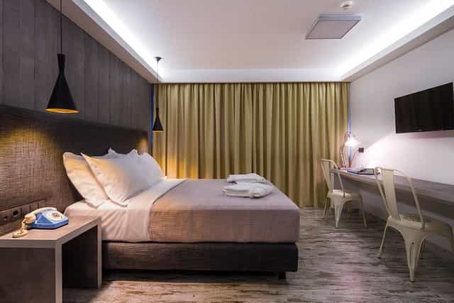 Modern hotel suite with workspace for business conferences and corporate travel.