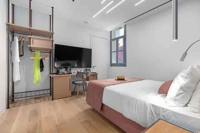 Modern Gaia accessible hotel room with workstation for business travel.