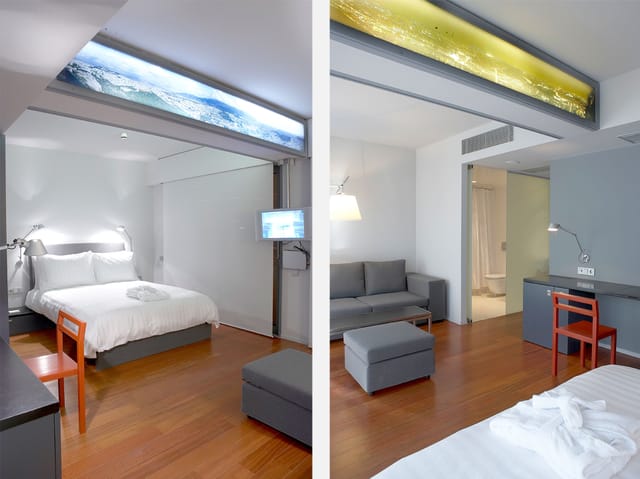 Dual-zone hotel suite for executive travel, featuring a workspace and sleeping area.