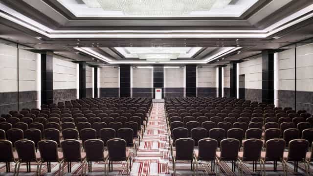 Theater-style Grand Hall conference room for corporate events and keynote presentations.