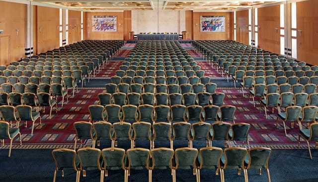 Theater-style ballroom at Divani Apollon Palace for large conferences and corporate keynotes.