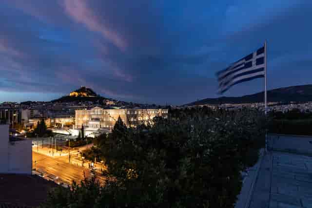 Amalia Athens Hotel conference room at dusk, ideal for corporate events and professional receptions.