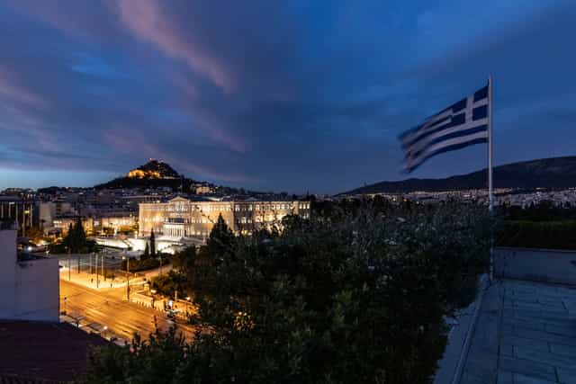 Amalia Athens Hotel conference room at dusk, ideal for corporate events and professional receptions.