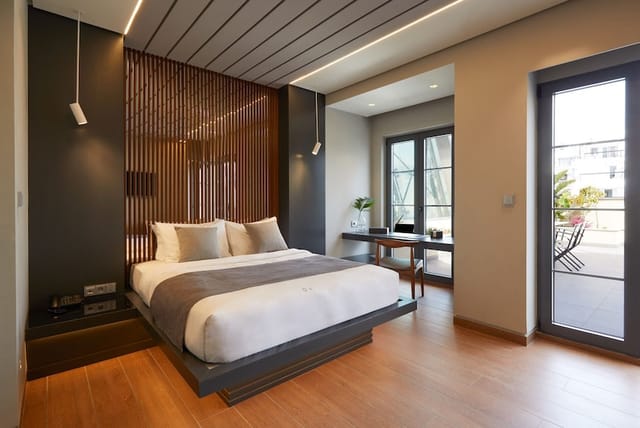 VIP guest room at Athens Ikon with workspace and terrace for corporate retreats and incentive travel.