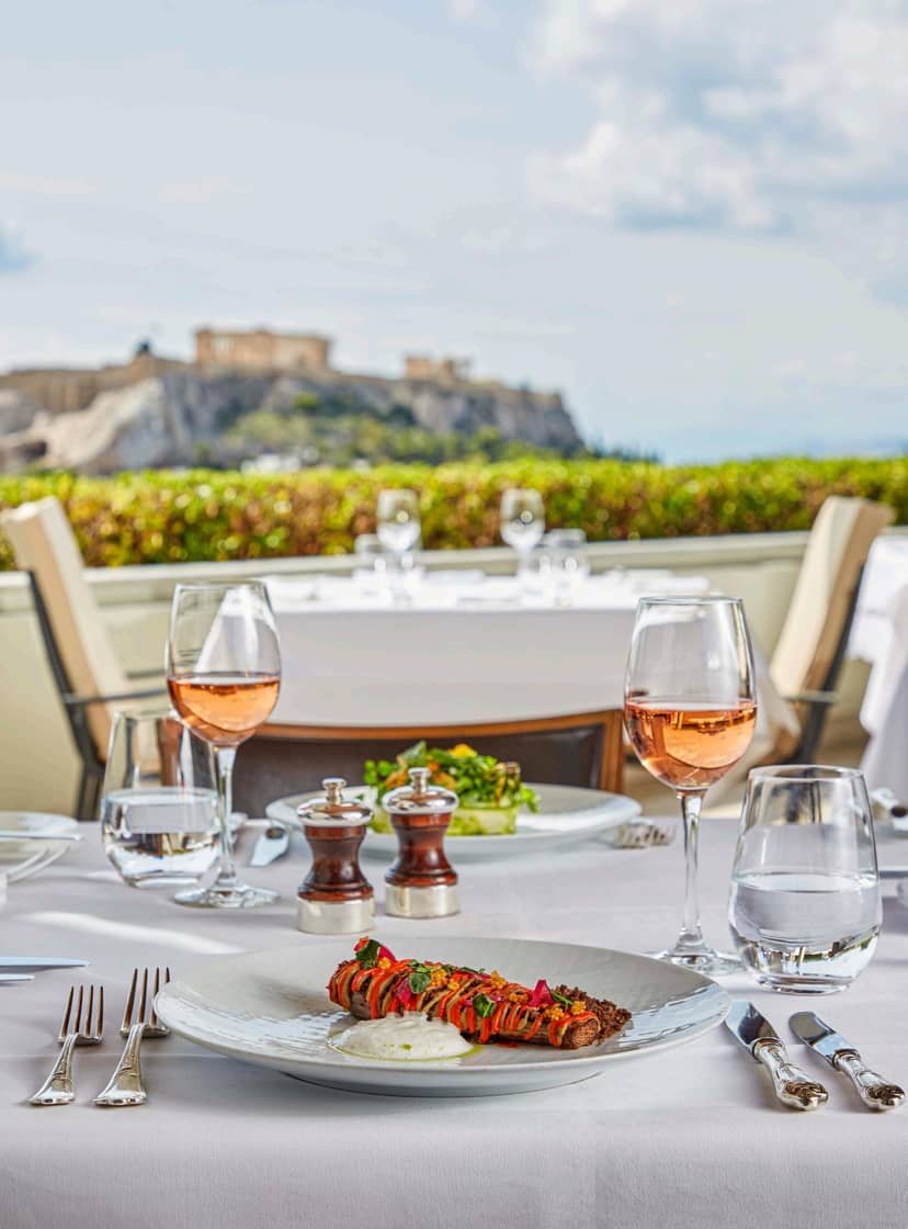 Luxury rooftop cigar lounge with Acropolis view for VIP receptions and corporate incentive dinners.