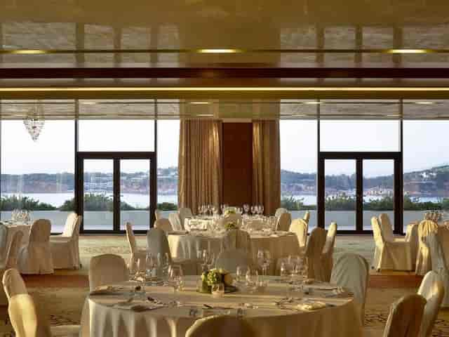 Luxury Four Seasons Athens ballroom with floor-to-ceiling windows for corporate galas or weddings.