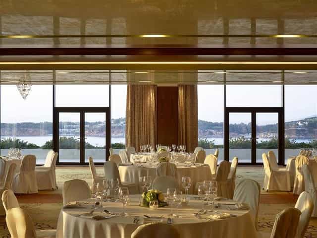 Luxury Four Seasons Athens ballroom with floor-to-ceiling windows for corporate galas or weddings.