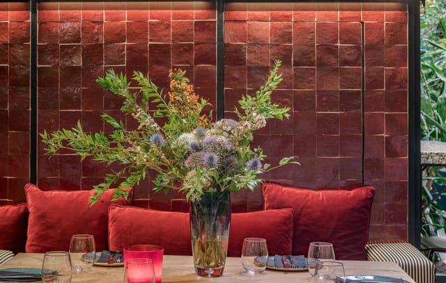 Private dining room at Malconi's with velvet decor for exclusive events and upscale client dinners.