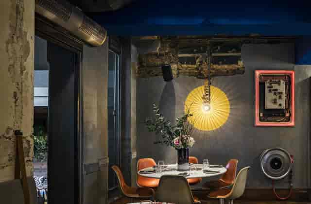 Industrial-chic private dining room at Malconi’s for VIP dinners and creative events.