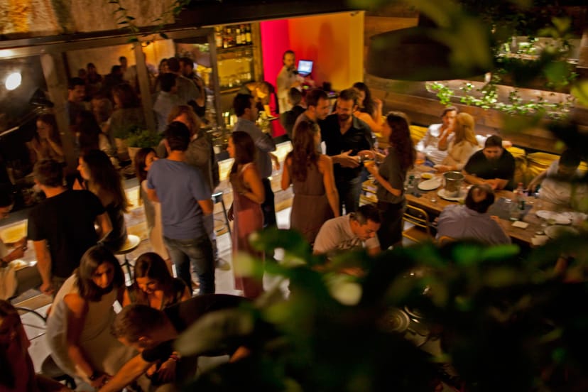 Malconi's restaurant evening reception, communal dining, networking event venue.