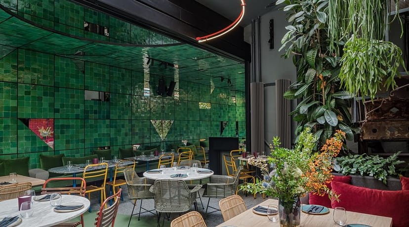 Emerald tile dining space for networking mixers and VIP corporate events.