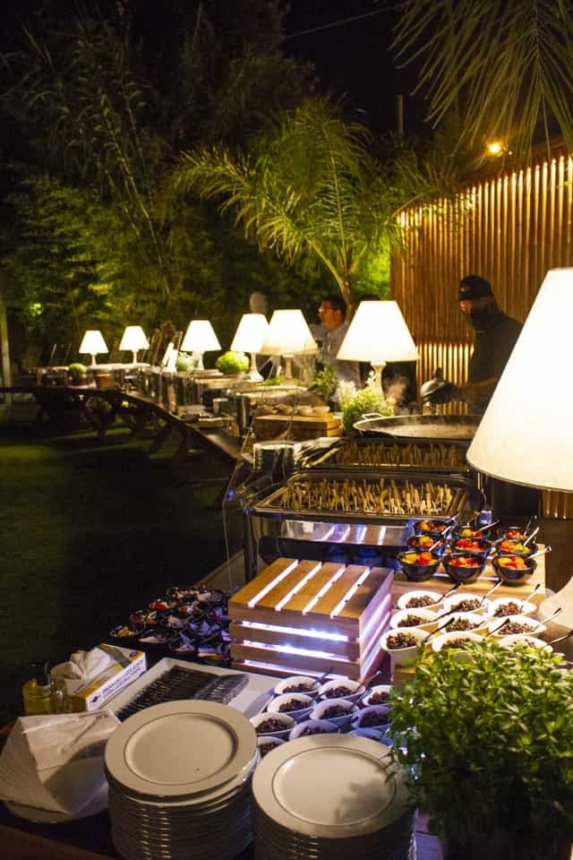 Catered buffet setup at Reef Athens Riviera for outdoor evening events and professional galas.