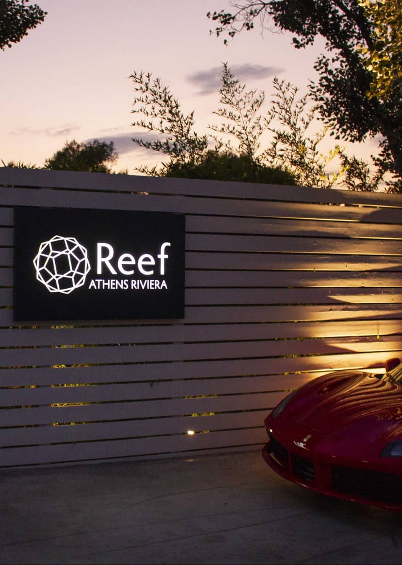 Upscale entrance at Reef Athens Riviera, modern venue for corporate events and networking.