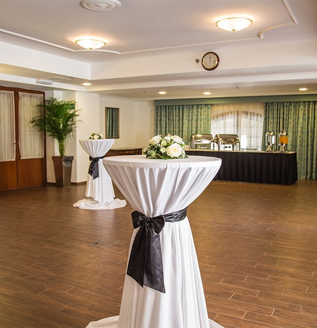 William Shakespeare Suite event setup with cocktail tables, floral decor, corporate gala or party.