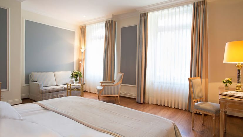 Luxury executive suite at Victoria-Jungfrau Grand Hotel & Spa for business travel room blocks.