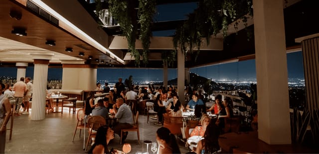 Rooftop terrace in Deos Athens with biophilic design for corporate networking and upscale events.