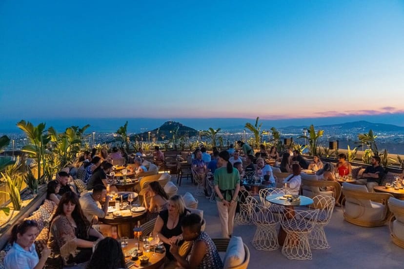 Deos Athens rooftop cocktail bar at sunset, perfect for premium networking and corporate events.