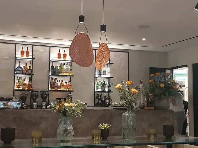 Upscale bar at Rick's American Steakhouse with warm lighting for VIP receptions and networking.