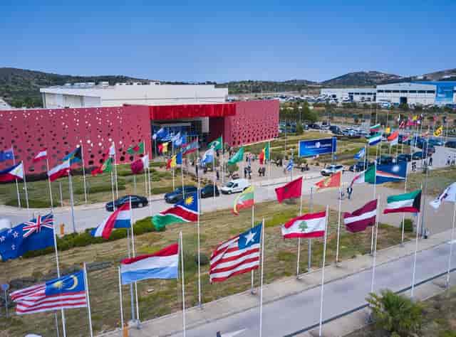 Metropolitan Expo exhibition hall with grand flags for international congress and delegation events.