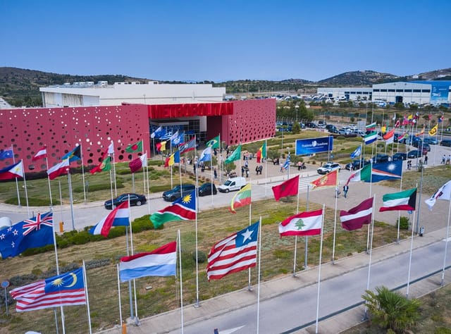 Metropolitan Expo exhibition hall with grand flags for international congress and delegation events.