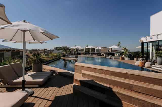 Rooftop corporate cocktail reception at Skylark Hotel Athens event hall.