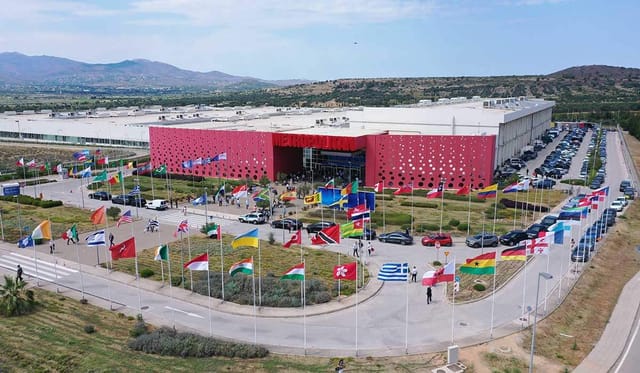 Metropolitan Expo exhibition hall with global flags for international summit or conference venue.