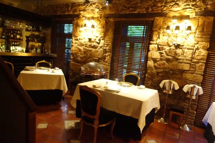 Intimate Spondi dining room for high-end corporate dinners and sophisticated breakout sessions.