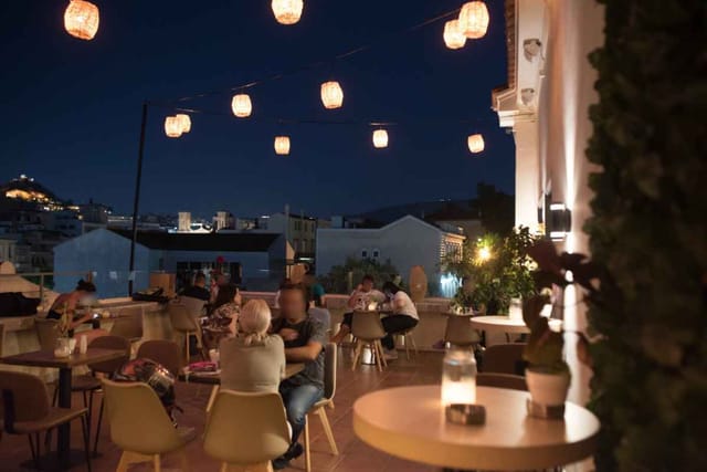 L'Amiral rooftop terrace with bistro lighting for evening networking reception.