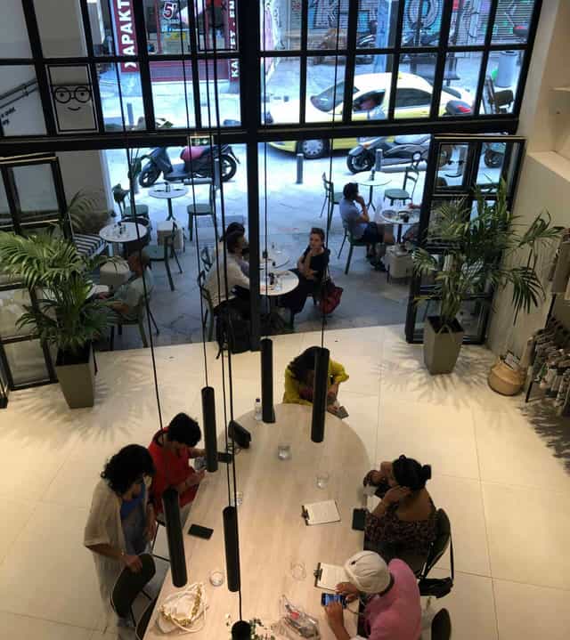 Modern casual networking space with greenery for business meetings and informal client events.
