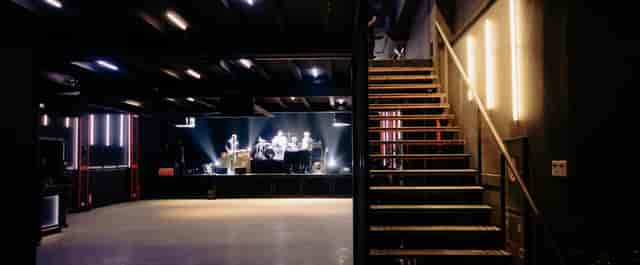Gazarte Ground Stage industrial venue with stage lighting for live music and corporate events.