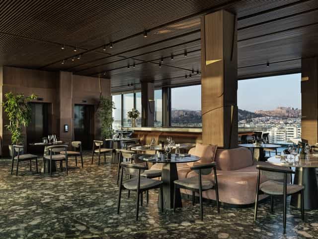 Luxury rooftop venue for corporate networking and VIP reception with panoramic architectural views.