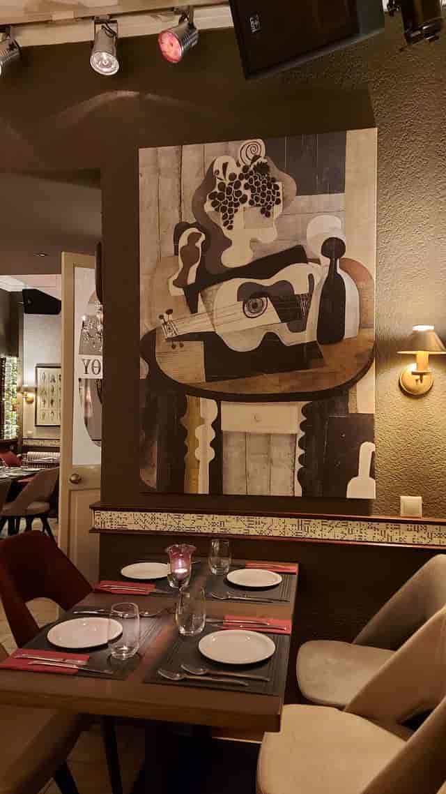 Intimate boutique event space with warm lighting for private dining and corporate meetings.