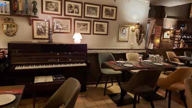 Intimate piano lounge at Enthymion Restaurant for boutique networking and client dinners.