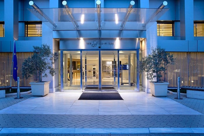 Modern Golden Age Hotel entrance for corporate event arrivals.