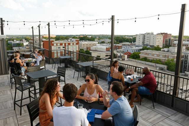 Rooftop patio with string lights at The Venue on Broad for networking events and social mixers.