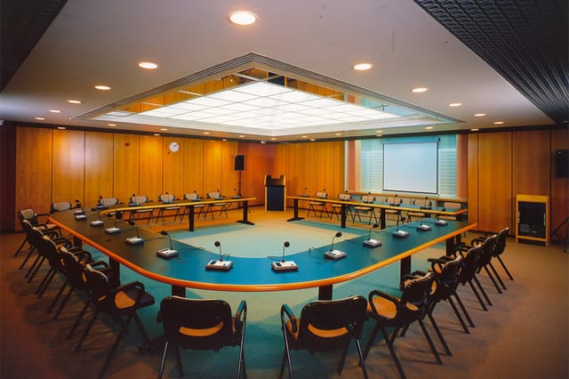 U-shape boardroom at DA 45 Event Venue with microphones, perfect for corporate meetings and events.