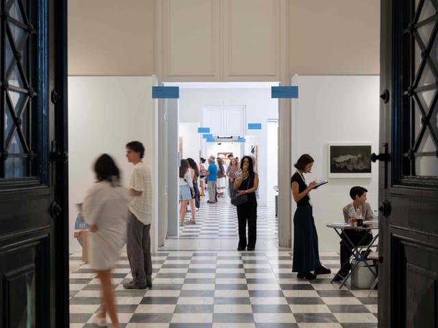 Mets Arts Centre gallery with clear signage and registration desk for event venue rental.