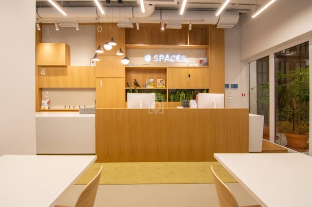 Modern reception area at Spaces Solonos for business coworking and event check-ins.