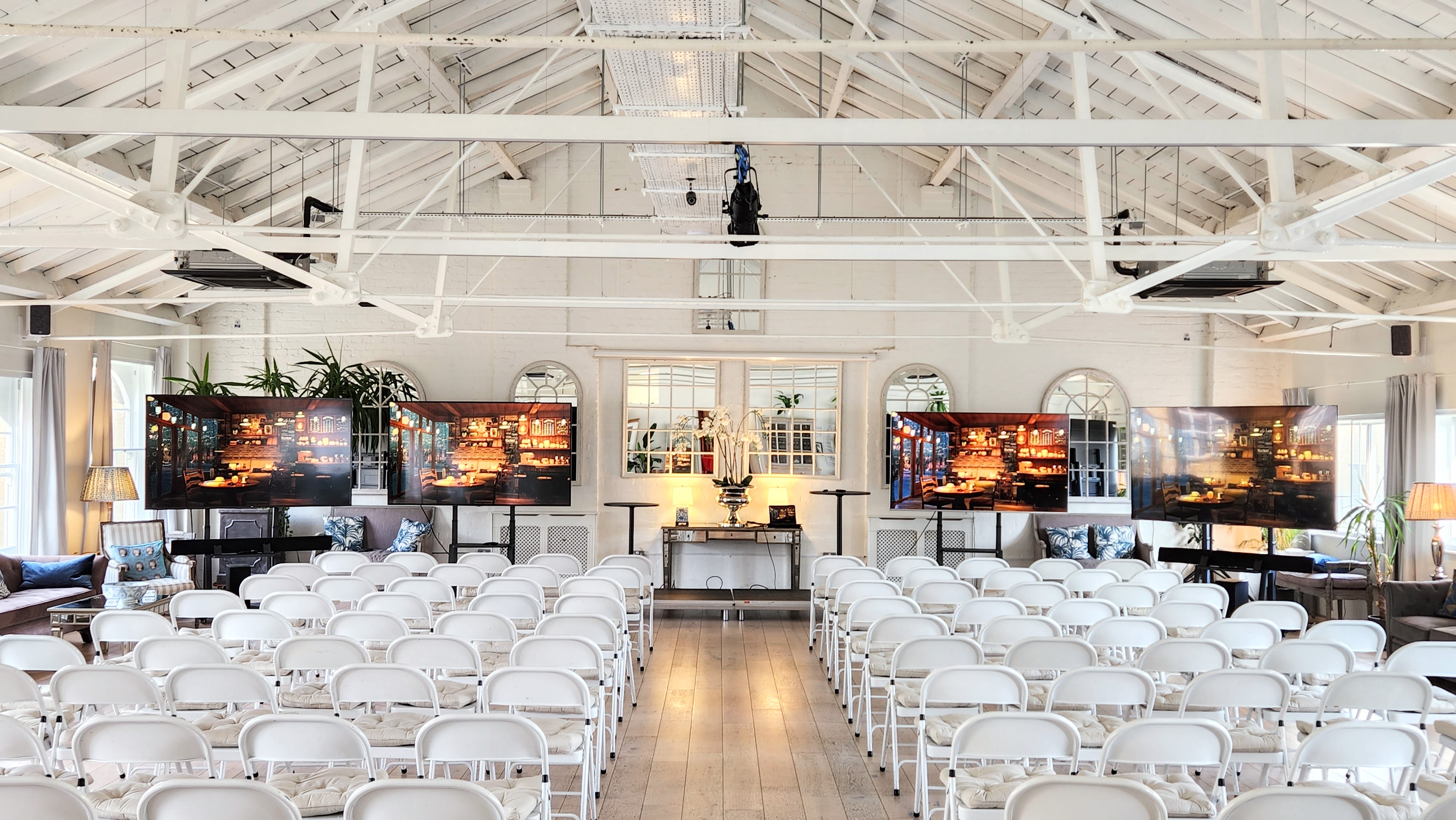 Underwood Flagship Venue with white chairs, ideal for corporate events and workshops. - Banner