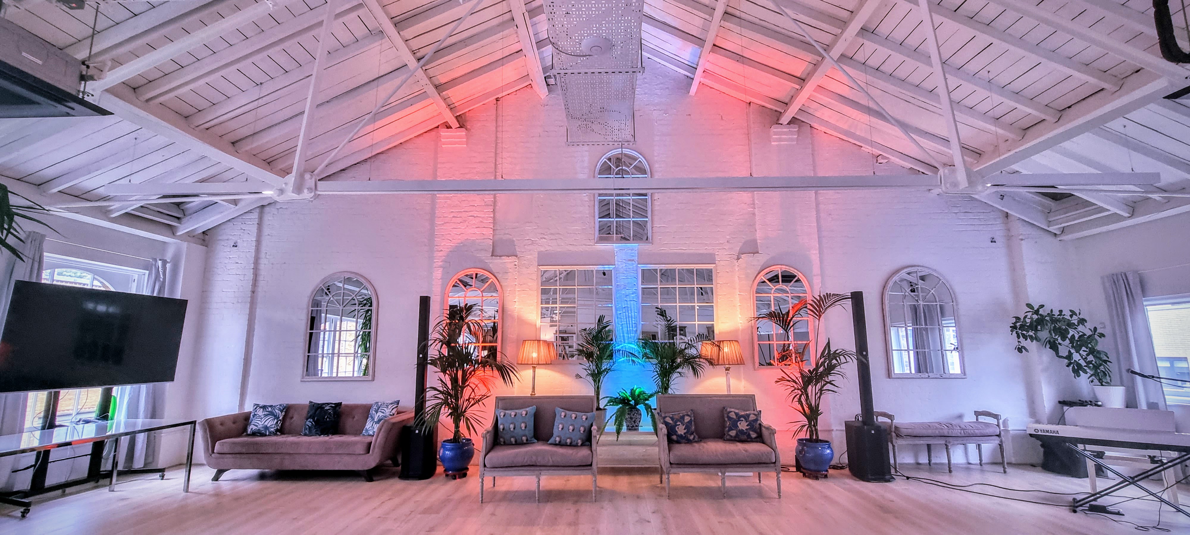 Underwood Flagship Venue: stylish event space with beamed ceiling, ideal for gatherings. - Banner