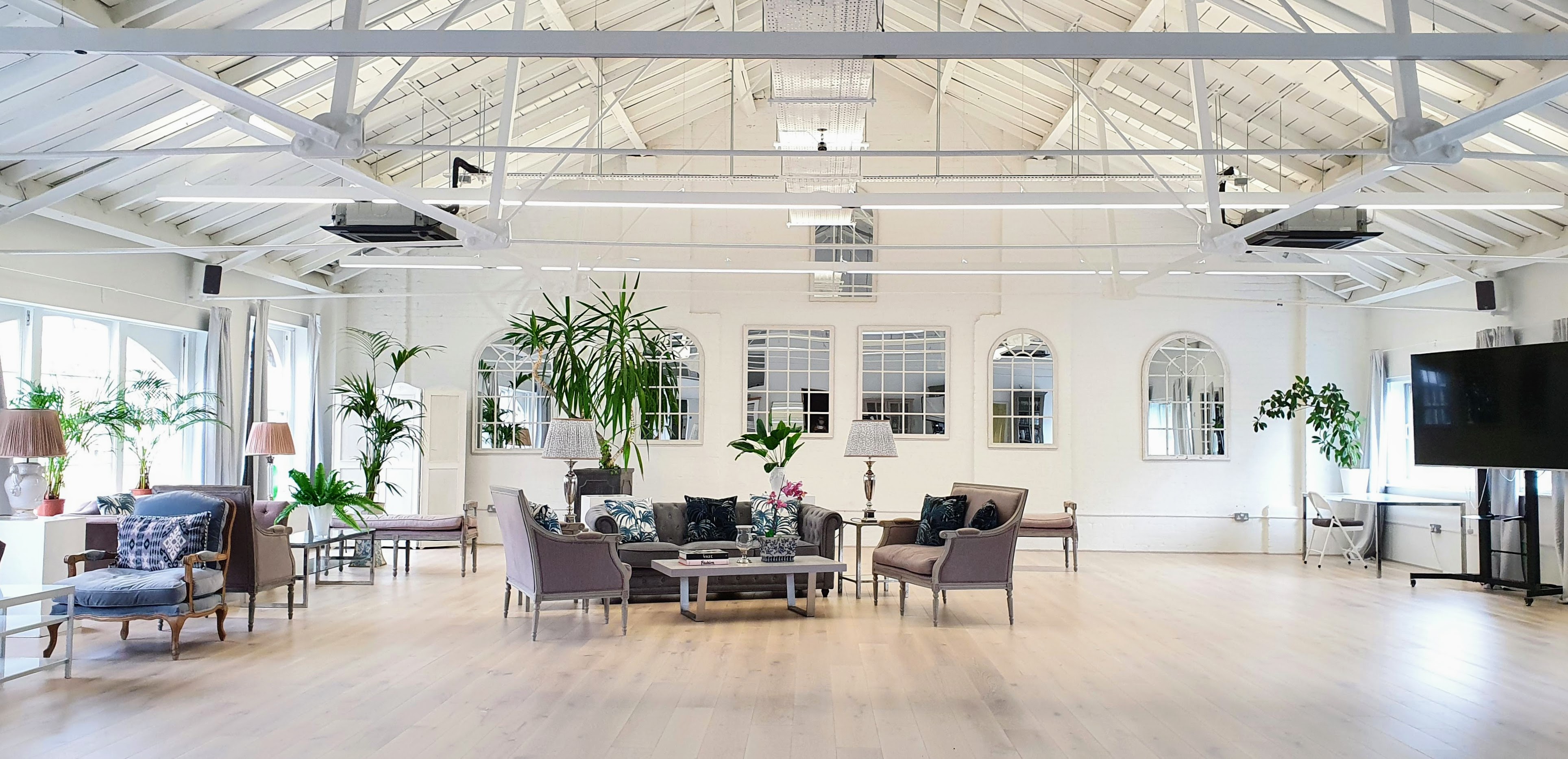 Bright meeting space at Underwood Flagship Venue with high ceilings for events and workshops. - Banner