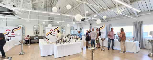 Underwood Flagship Venue with white tables, perfect for networking and tasting events.