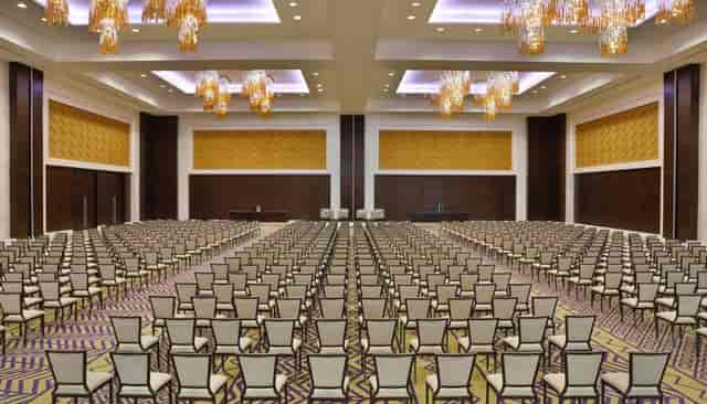 Al Hamra Ballroom: Pillarless theater setup for corporate presentations and keynote events.