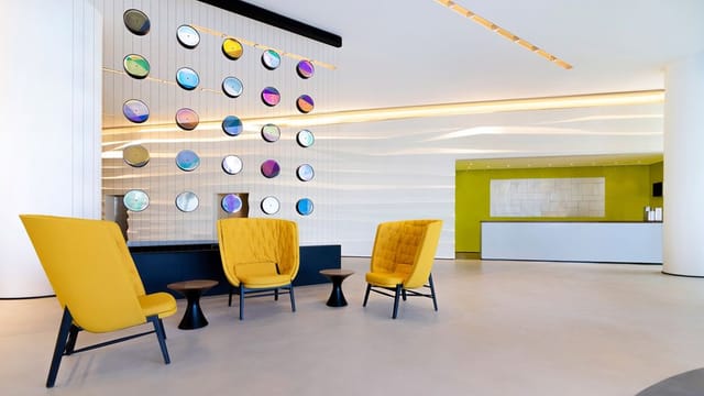 Modern foyer at Le Méridien Riyadh with lounge seating for corporate events and conferences.