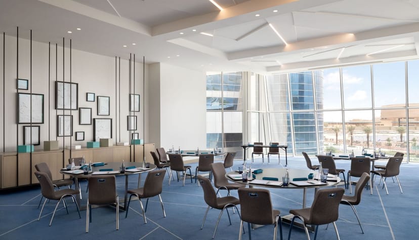 Le Méridien Riyadh breakout room with circular pods for corporate workshops and strategic sessions.