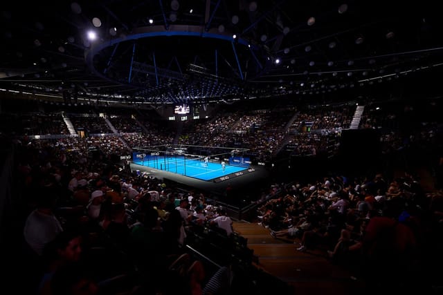 VIP lounge at The Arena Riyadh with circular staging and theatrical lighting for corporate events.