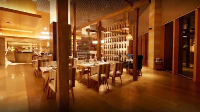 Upscale La Brasserie dining room with timber features for corporate dinners and VIP events.