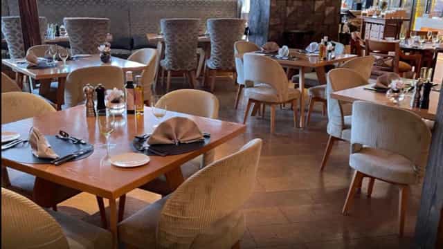 La Brasserie restaurant dining room with plush seating for corporate events and business lunches.