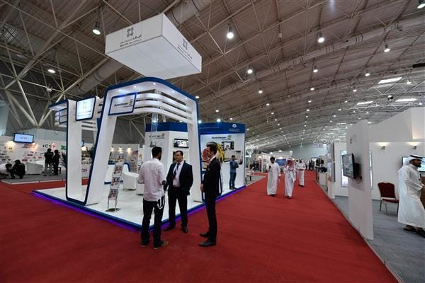 Modern exhibition booths at Riyadh trade show: professional B2B networking event floor.